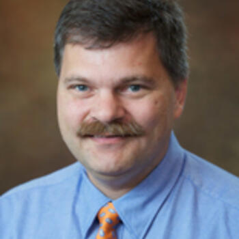 Dr. Chris E. Johnson